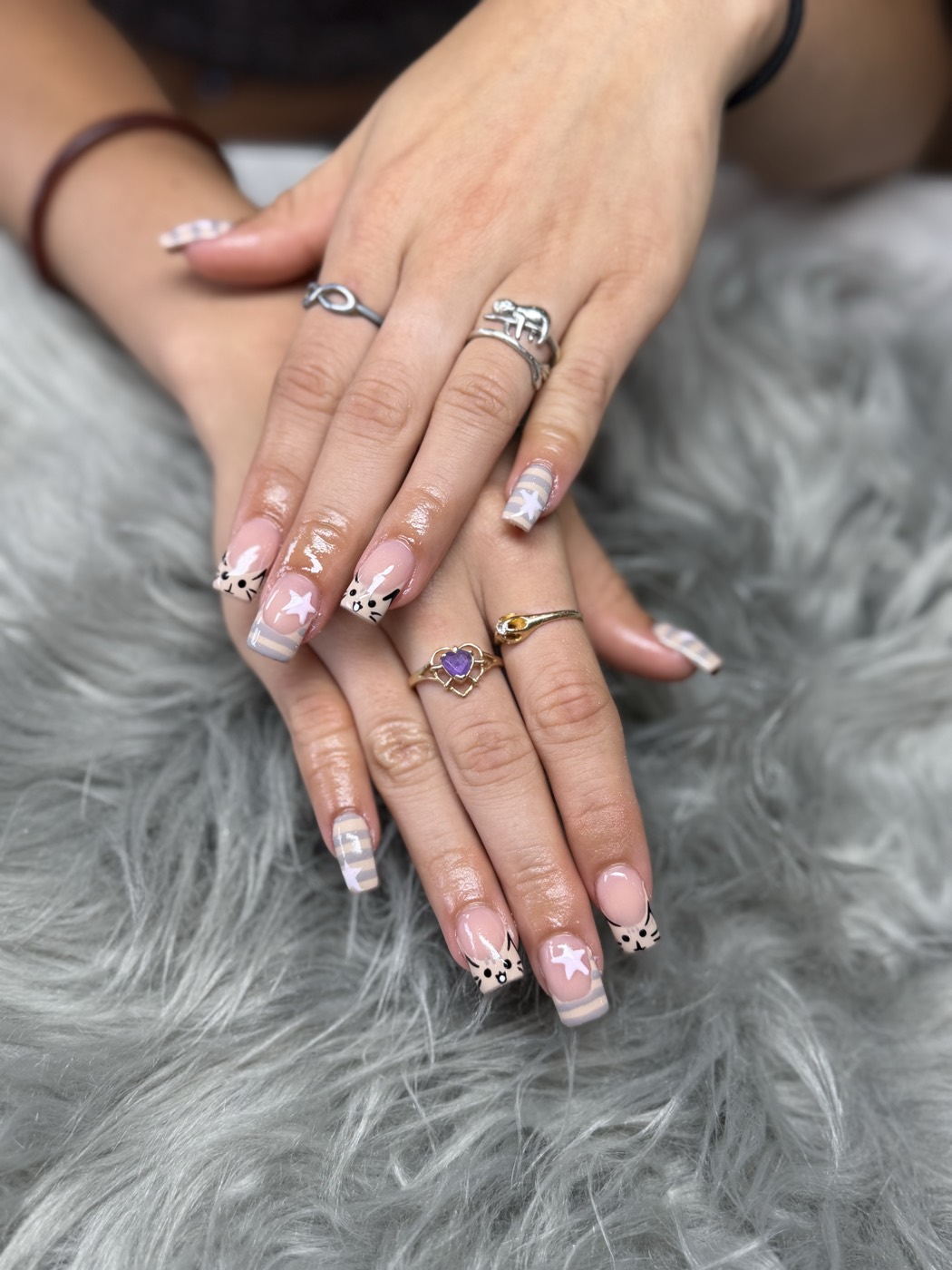 Short square French with hand-painted cats, stars and pastel stripes
